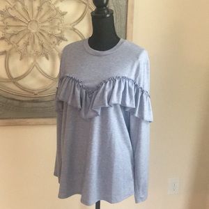 Cozy fleece with ruffle accent!